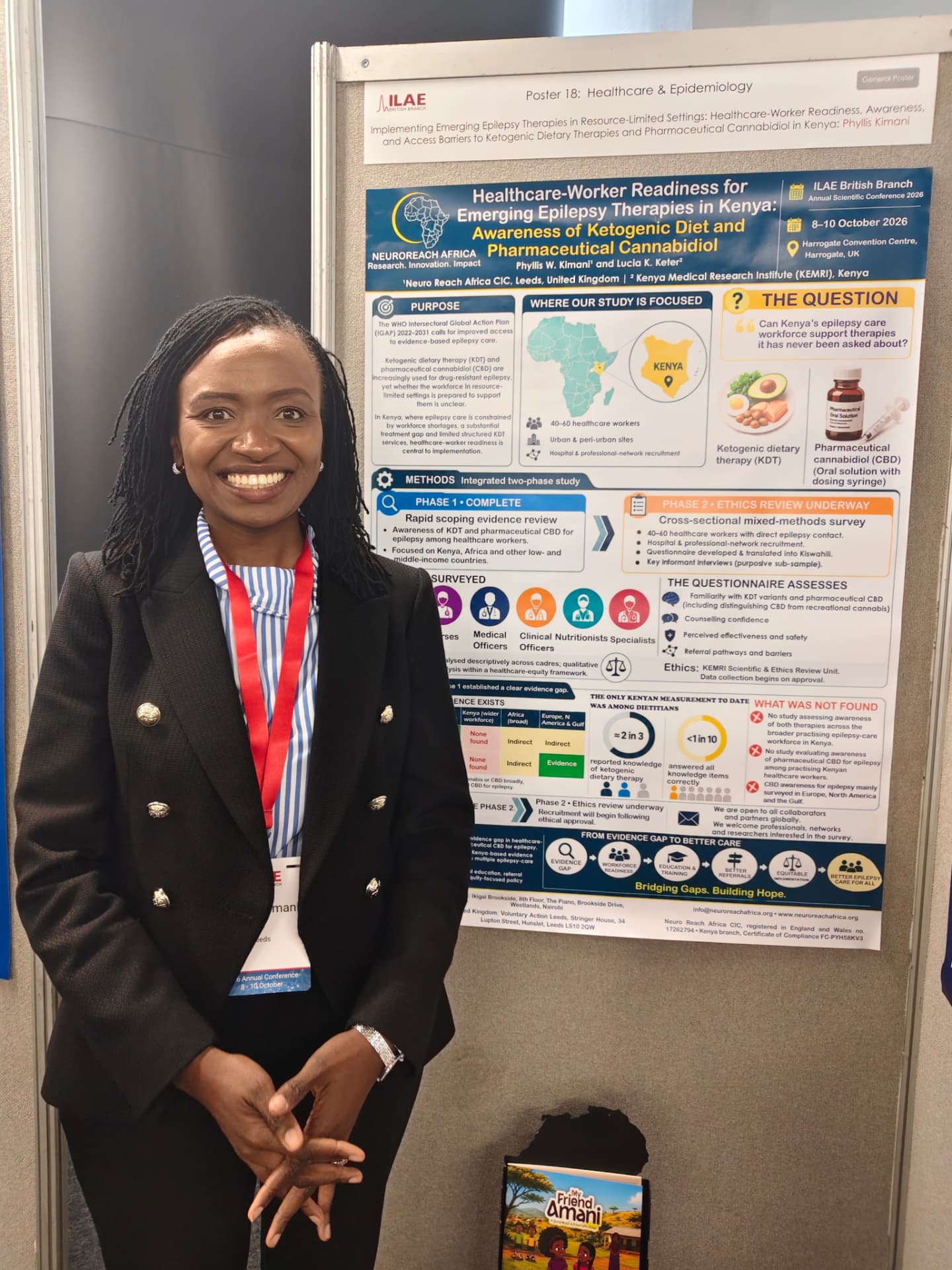Dr. Phyllis Kimani beside her poster in Harrogate